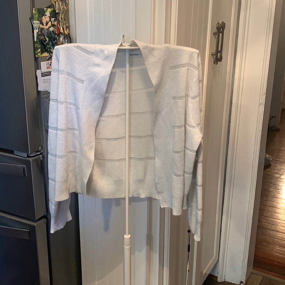 Calvin Klein white and silver metallic cropped shrug/ open cardigan. NWT. 39.00